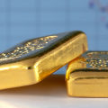 Is it better to buy gold or gold stock?